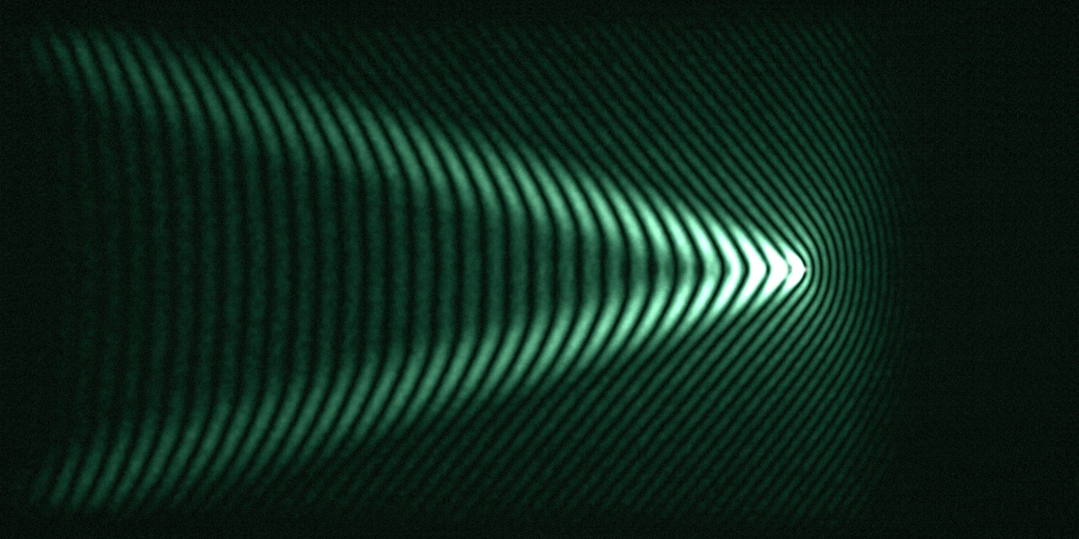 the radar V — bright backscatter on a black sea, the wake as orbit actually records it